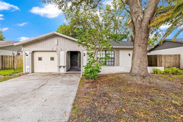2986 Cypress Green Dr, Palm Harbor, FL 34684 - single story home with an attached garage, stucco siding, and driveway