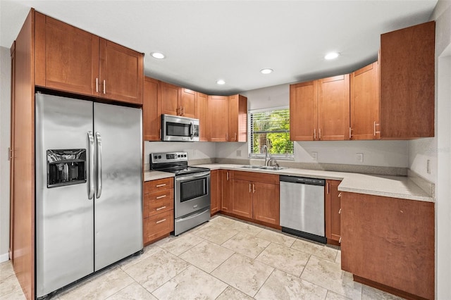 2986 Cypress Green Dr, Palm Harbor, FL 34684 - kitchen with appliances with stainless steel finishes, recessed lighting, light countertops, and brown cabinetry