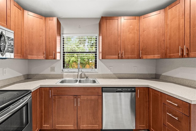 2986 Cypress Green Dr, Palm Harbor, FL 34684 - kitchen featuring appliances with stainless steel finishes, light countertops, and brown cabinets