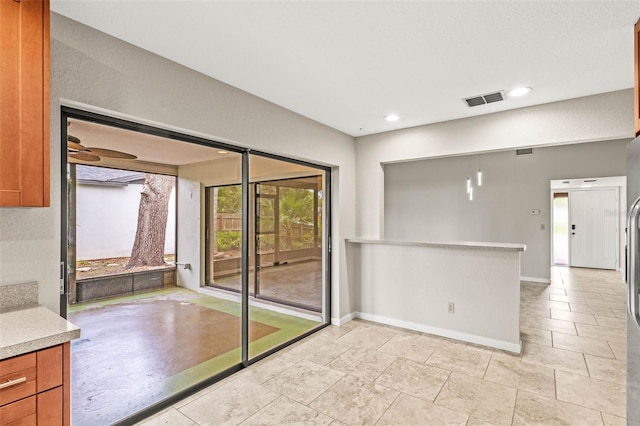 2986 Cypress Green Dr, Palm Harbor, FL 34684 - kitchen with light countertops, brown cabinets, and recessed lighting