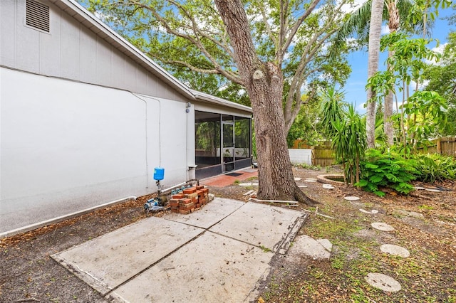 2986 Cypress Green Dr, Palm Harbor, FL 34684 - fenced backyard featuring a sunroom and a patio