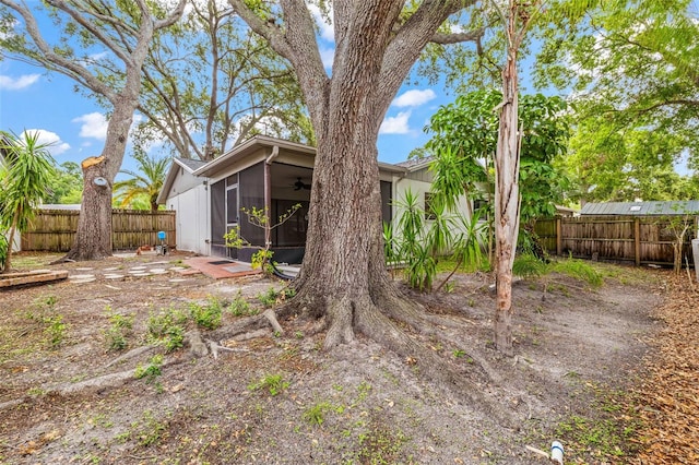 2986 Cypress Green Dr, Palm Harbor, FL 34684 - fenced backyard featuring a sunroom and ceiling fan