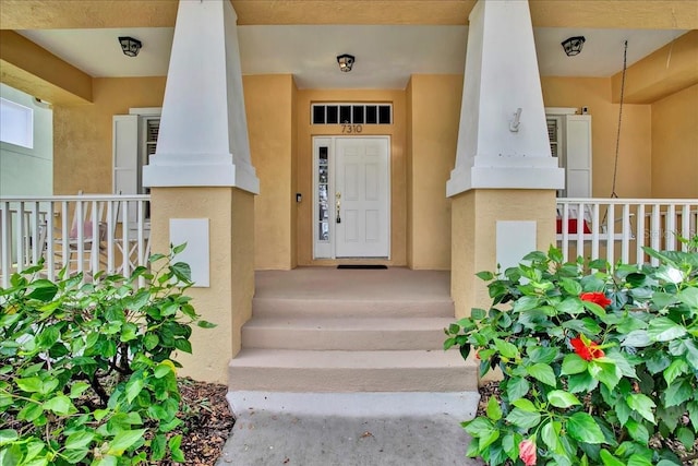 7310 S Shamrock Rd, Tampa, FL 33616 - property entrance with stucco siding