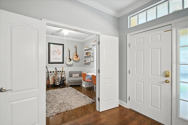 7310 S Shamrock Rd, Tampa, FL 33616 - entrance foyer with ornamental molding, dark wood finished floors, and plenty of natural light