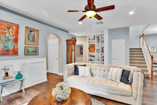 7310 S Shamrock Rd, Tampa, FL 33616 - living area featuring arched walkways, a ceiling fan, dark wood finished floors, recessed lighting, and built in features