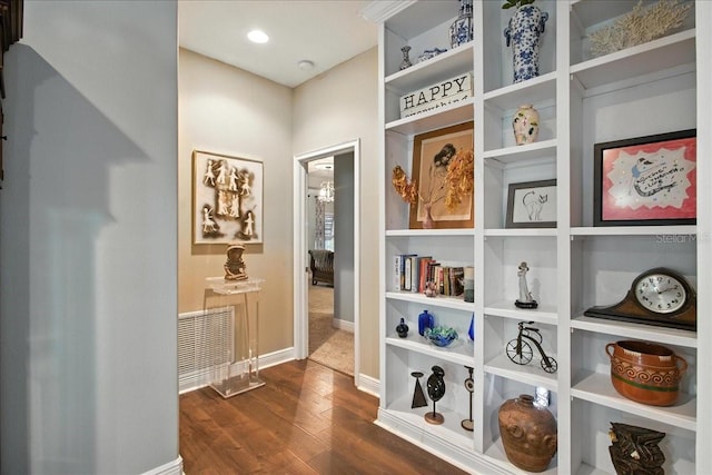 7310 S Shamrock Rd, Tampa, FL 33616 - hall with dark wood-type flooring and baseboards
