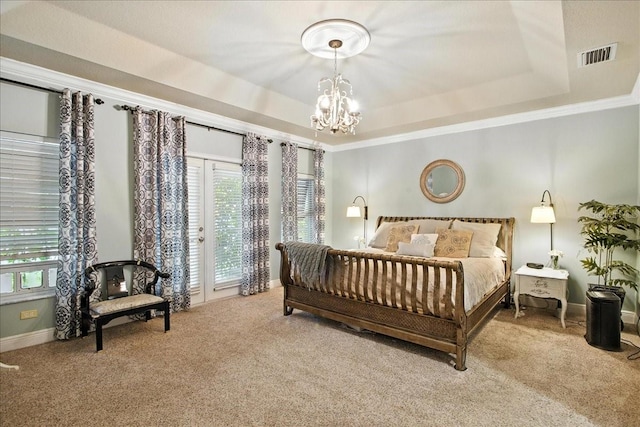 7310 S Shamrock Rd, Tampa, FL 33616 - bedroom with carpet, a tray ceiling, a chandelier, and ornamental molding