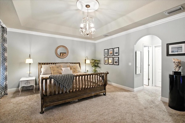7310 S Shamrock Rd, Tampa, FL 33616 - bedroom with a tray ceiling, carpet, arched walkways, a chandelier, and crown molding