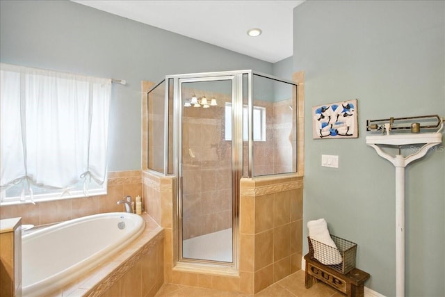 7310 S Shamrock Rd, Tampa, FL 33616 - bathroom featuring a shower stall, a garden tub, plenty of natural light, and tile patterned flooring