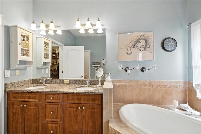 7310 S Shamrock Rd, Tampa, FL 33616 - bathroom with a bath and double vanity