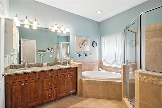 7310 S Shamrock Rd, Tampa, FL 33616 - bathroom featuring a stall shower, tile patterned floors, a bath, and double vanity