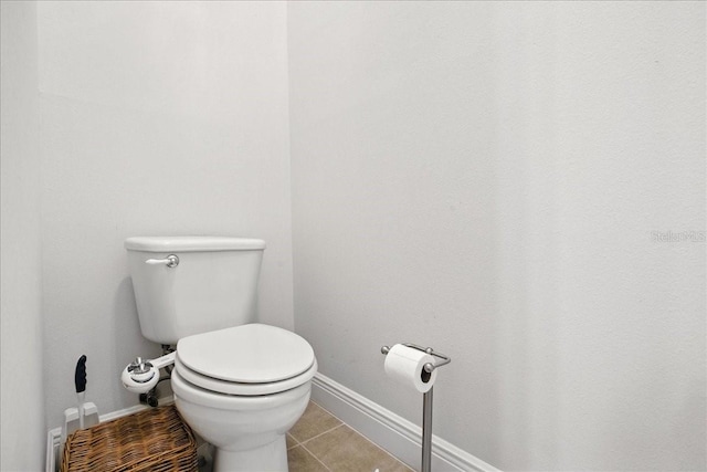 7310 S Shamrock Rd, Tampa, FL 33616 - bathroom with toilet and tile patterned flooring