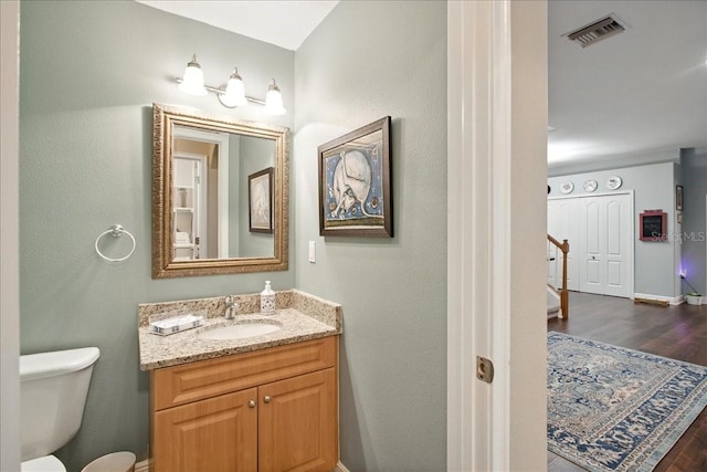 7310 S Shamrock Rd, Tampa, FL 33616 - bathroom featuring wood finished floors and vanity