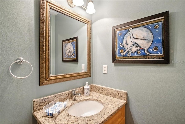 7310 S Shamrock Rd, Tampa, FL 33616 - bathroom with vanity and a textured wall