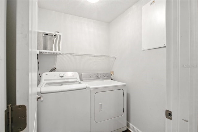 7310 S Shamrock Rd, Tampa, FL 33616 - laundry area with washing machine and clothes dryer