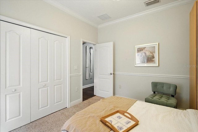 7310 S Shamrock Rd, Tampa, FL 33616 - carpeted bedroom with ornamental molding and a closet