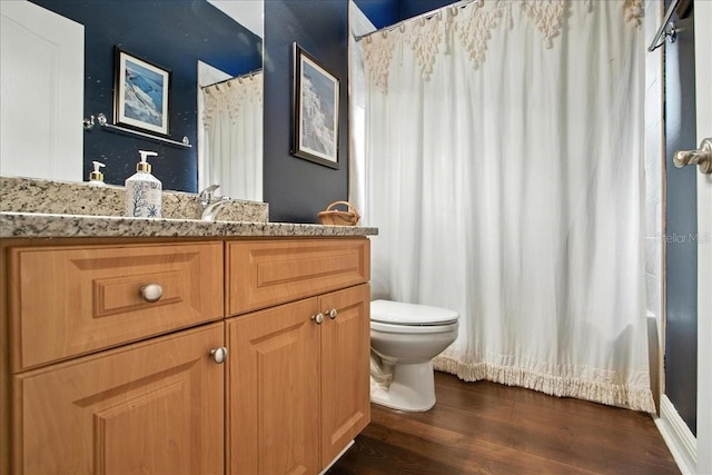 7310 S Shamrock Rd, Tampa, FL 33616 - bathroom featuring wood finished floors and vanity