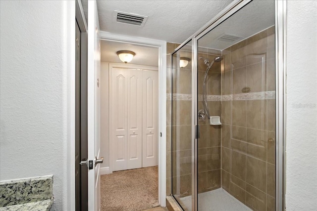 7310 S Shamrock Rd, Tampa, FL 33616 - bathroom with a shower stall and a textured ceiling