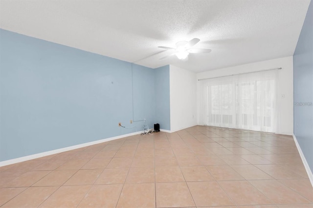 845 Maple Ct Unit 103, Dunedin, FL 34698 - unfurnished room featuring a ceiling fan, a textured ceiling, and light tile patterned flooring