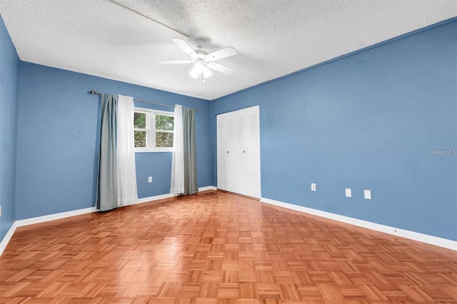 845 Maple Ct Unit 103, Dunedin, FL 34698 - spare room with ceiling fan and a textured ceiling