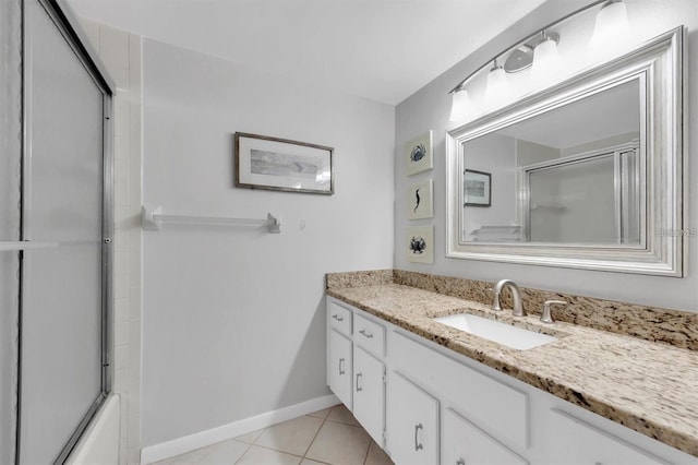 845 Maple Ct Unit 103, Dunedin, FL 34698 - full bath featuring vanity, enclosed tub / shower combo, and tile patterned flooring