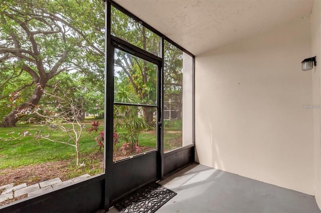 845 Maple Ct Unit 103, Dunedin, FL 34698 - unfurnished sunroom with lofted ceiling