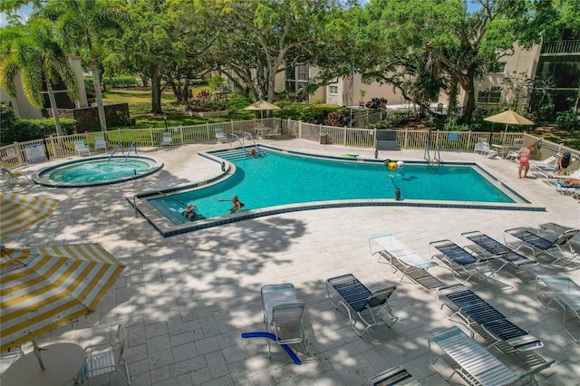 845 Maple Ct Unit 103, Dunedin, FL 34698 - community pool featuring a patio area and a community hot tub