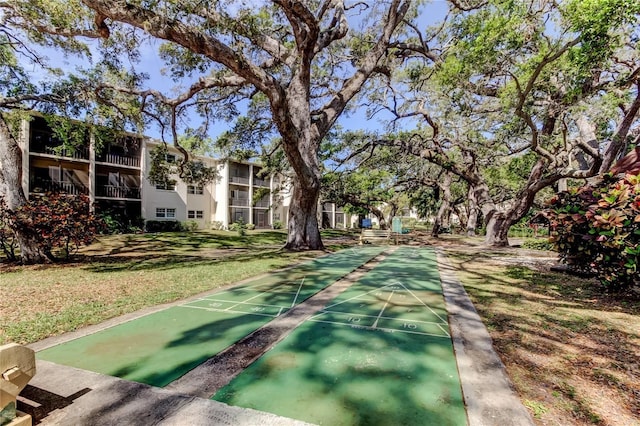 845 Maple Ct Unit 103, Dunedin, FL 34698 - view of home's community featuring shuffleboard and a yard