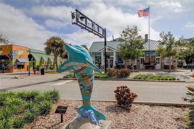 845 Maple Ct Unit 103, Dunedin, FL 34698 - view of asphalt road featuring curbs, sidewalks, and street lighting