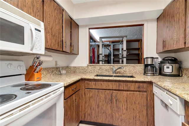 3129 W Paris St, Tampa, FL 33614 - kitchen featuring white appliances and brown cabinets
