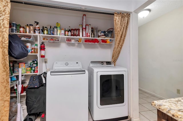 3129 W Paris St, Tampa, FL 33614 - washroom featuring washing machine and dryer and light tile patterned floors