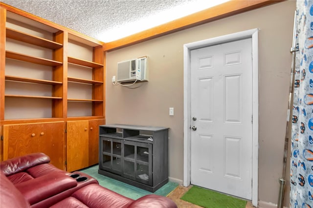 3129 W Paris St, Tampa, FL 33614 - living room with a wall mounted air conditioner and a textured ceiling