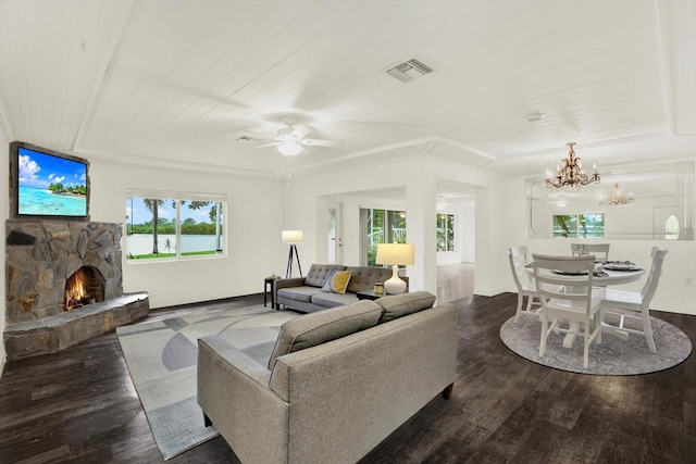 102 W N Branch Rd, Ruskin, FL 33570 - living area with a stone fireplace, a chandelier, wood finished floors, and ceiling fan