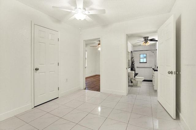 102 W N Branch Rd, Ruskin, FL 33570 - unfurnished bedroom with ensuite bath and a ceiling fan