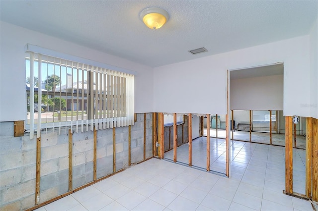 123 11th Ave, Indian Rocks Beach, FL 33785 - spare room with a textured ceiling