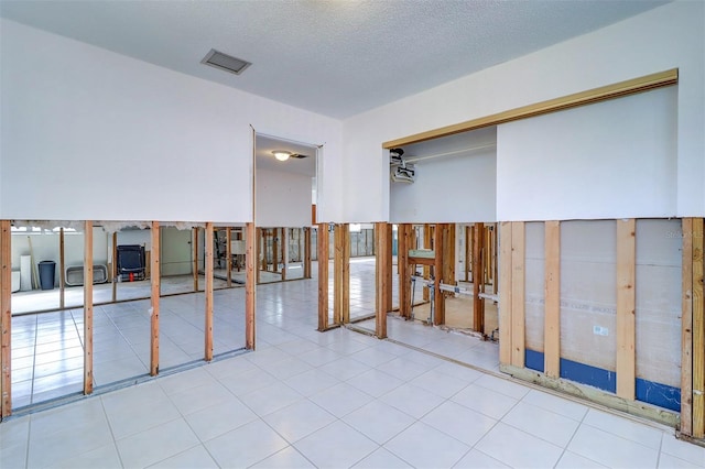 123 11th Ave, Indian Rocks Beach, FL 33785 - spare room with a textured ceiling