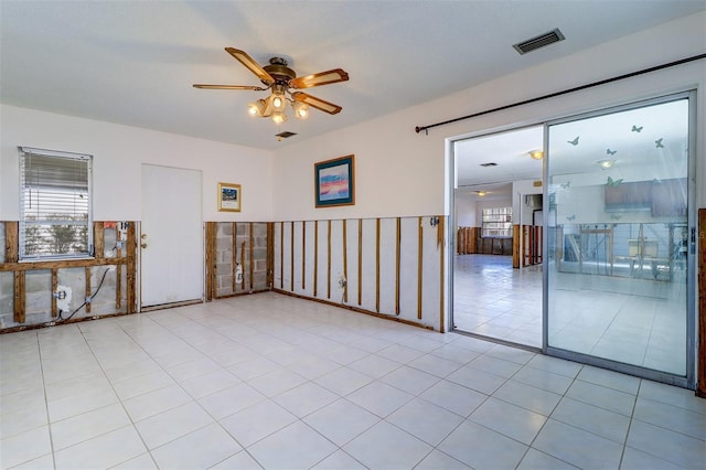123 11th Ave, Indian Rocks Beach, FL 33785 - spare room with a ceiling fan and a wainscoted wall
