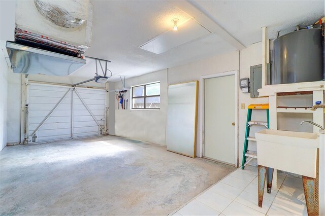 123 11th Ave, Indian Rocks Beach, FL 33785 - garage featuring a garage door opener and water heater