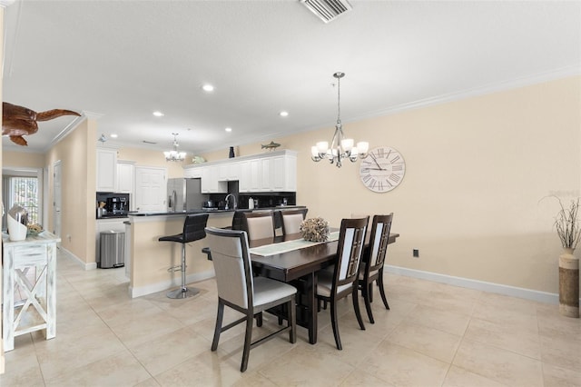 300 Capri Blvd Unit 3, Treasure Island, FL 33706 - dining area featuring ornamental molding, a chandelier, light tile patterned floors, and recessed lighting