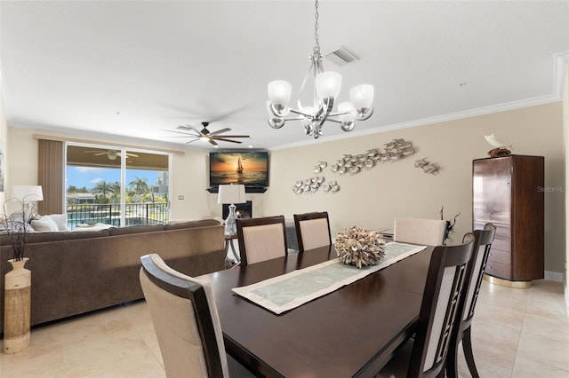 300 Capri Blvd Unit 3, Treasure Island, FL 33706 - dining area featuring light tile patterned flooring, a ceiling fan, a chandelier, and crown molding