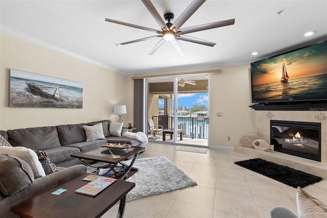 300 Capri Blvd Unit 3, Treasure Island, FL 33706 - tiled living area featuring ornamental molding, a ceiling fan, a large fireplace, and recessed lighting