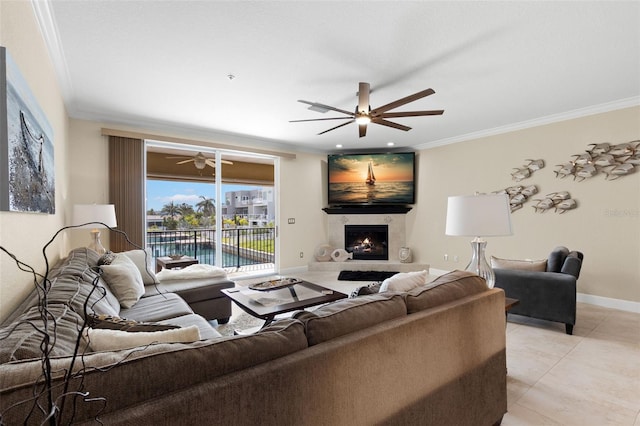 300 Capri Blvd Unit 3, Treasure Island, FL 33706 - living area featuring ornamental molding, a ceiling fan, a warm lit fireplace, and light tile patterned floors