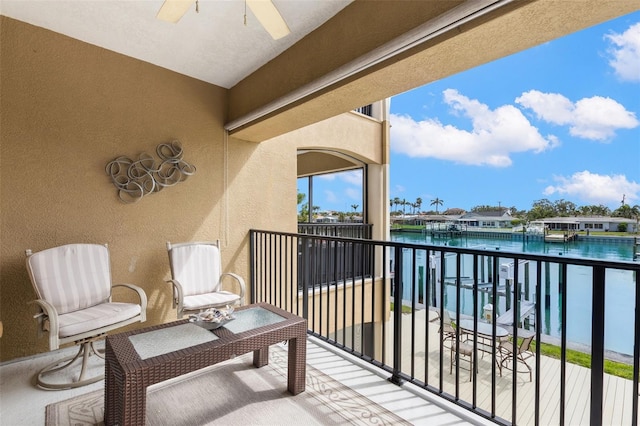 300 Capri Blvd Unit 3, Treasure Island, FL 33706 - balcony featuring a water view and ceiling fan