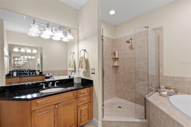 300 Capri Blvd Unit 3, Treasure Island, FL 33706 - bathroom with a stall shower, a garden tub, and vanity