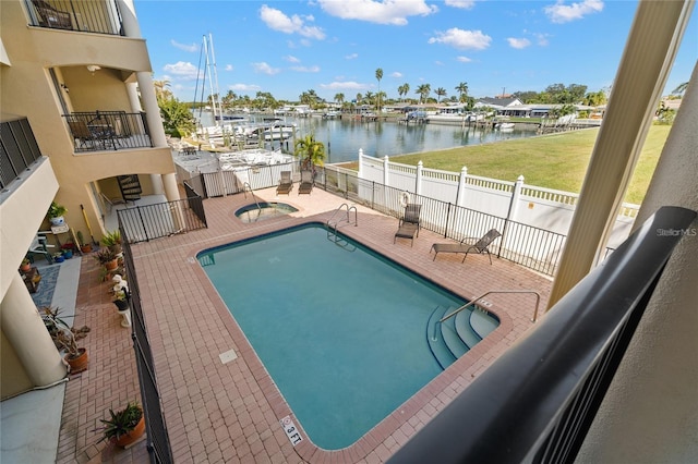 300 Capri Blvd Unit 3, Treasure Island, FL 33706 - community pool featuring a water view and a patio