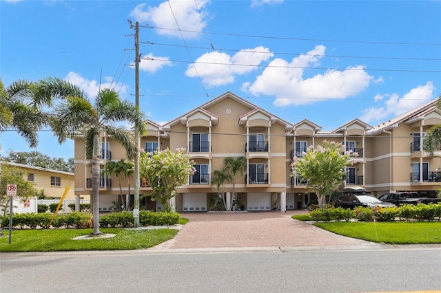 300 Capri Blvd Unit 3, Treasure Island, FL 33706 - view of property with a garage and driveway