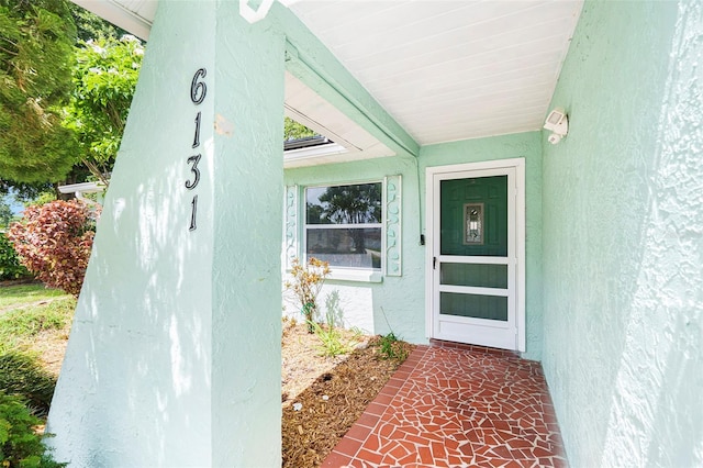 6131 17th St, Zephyrhills, FL 33542 - doorway to property with stucco siding