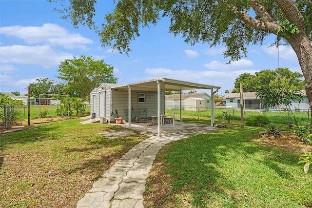 6131 17th St, Zephyrhills, FL 33542 - fenced backyard with a patio and a shed