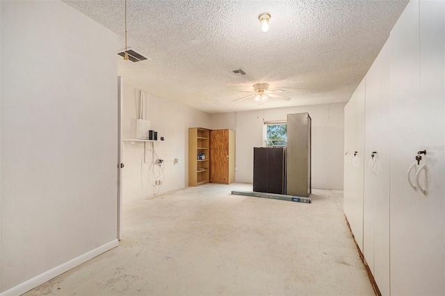 6131 17th St, Zephyrhills, FL 33542 - unfurnished living room with a textured ceiling, a ceiling fan, and concrete floors
