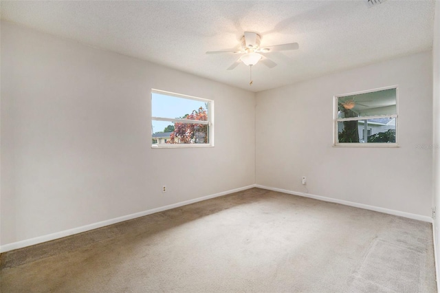 6131 17th St, Zephyrhills, FL 33542 - unfurnished room with carpet floors, ceiling fan, and a textured ceiling